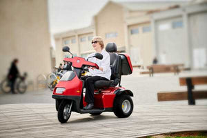 woman on Red Afiscooter S3 3-Wheel Electric Scooter By Afikim | Wheelchair Liberty