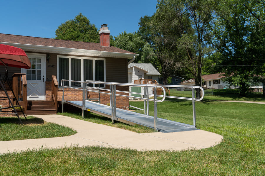 house with a pathway 3g ramp system with solid surface aluminum and 2 line handrails 