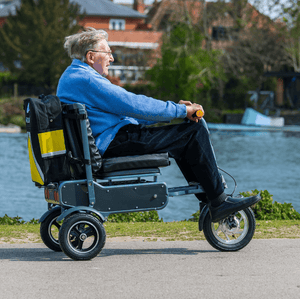 man using Afikim eFoldi explorer Wheelchair Liberty