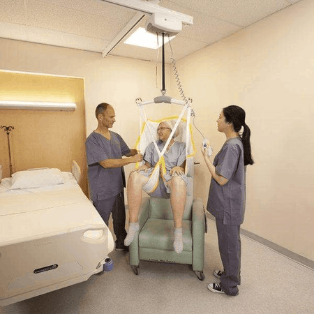 Bed To Chair Caregiver Use - C-450 Fixed Ceiling Patient Lift By Handicare | Wheelchair Liberty