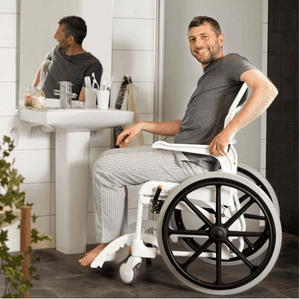 CLEAN Self-Propelled Shower with 24 Inch Rear Wheels - Guy In Bathroom