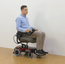 EZ-GO Lightweight Portable Power Wheelchair P321 - In-use - by Merits | Wheelchair Liberty