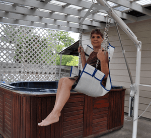 LIfting woman onto an above ground jacuzzi using Super Power EZ Above-Ground Pool lift by Aqua Creek | Wheelchair Liberty