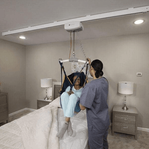 On Bed Lift Caregiver Side - C-450 Fixed Ceiling Patient Lift By Handicare | Wheelchair Liberty