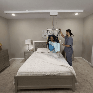 On Bed Lift Front View - C-450 Fixed Ceiling Patient Lift By Handicare | Wheelchair Liberty