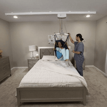 On Bed Lift Front View - C-625 Fixed Ceiling Patient Lift By Handicare | Wheelchair Liberty