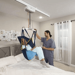On Bed Lift Side View - C-450 Fixed Ceiling Patient Lift By Handicare | Wheelchair Liberty