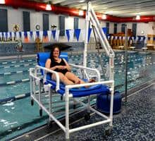 Woman in Stretcher Bed -Revolution Power Pool Lift ADA Compliant by Aqua Creek | Wheelchair Liberty