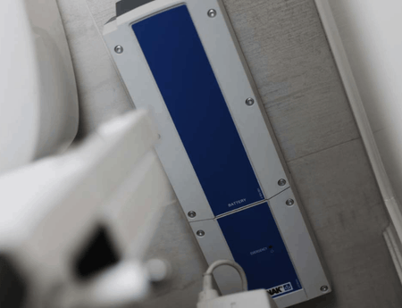 Wall Mounted Batter Pack  On Wall- TILT® Toilet Incline Lift by EZ-Access | Wheelchair LIberty