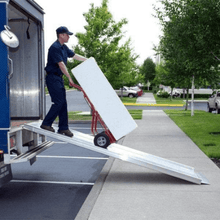 Man unloading shipment from truck using TRAVERSE™ Portable Walk Ramp by EZ-Access | Wheelchair Liberty