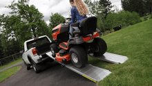 TRAVERSE Singlefold Edgeles Portable Ramp Loading A Lawn Mawer On Ramp By EZ-Access | Wheelchair Liberty