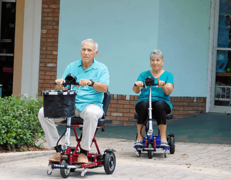 Triaxe CRUZE Scooter - On Stone Surface  -  by Enhance Mobility | Wheelchair Liberty