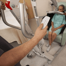 Woman Lifted From Chair - Eva Floor Mobile Patient Lifts By Handicare | Wheelchair Liberty