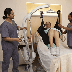 Woman Lifter From The Bed - Eva Floor Mobile Patient Lifts By Handicare | Wheelchair Liberty
