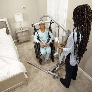 Woman Transferred Into Wheelchair - Carina350 Mobile Patient Lifts By Handicare | Wheelchair Liberty