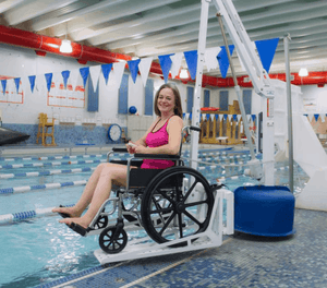 Woman in Wheelchair Using Revolution Power Pool Lift ADA Compliant by Aqua Creek | Wheelchair Liberty
