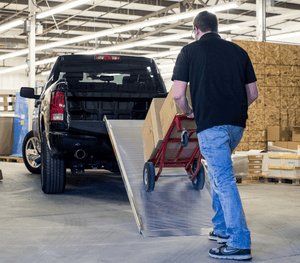 Man Loading Packages on a pick-up truck using TRAVERSE™ Portable Walk Ramp by EZ-Access | Wheelchair Liberty